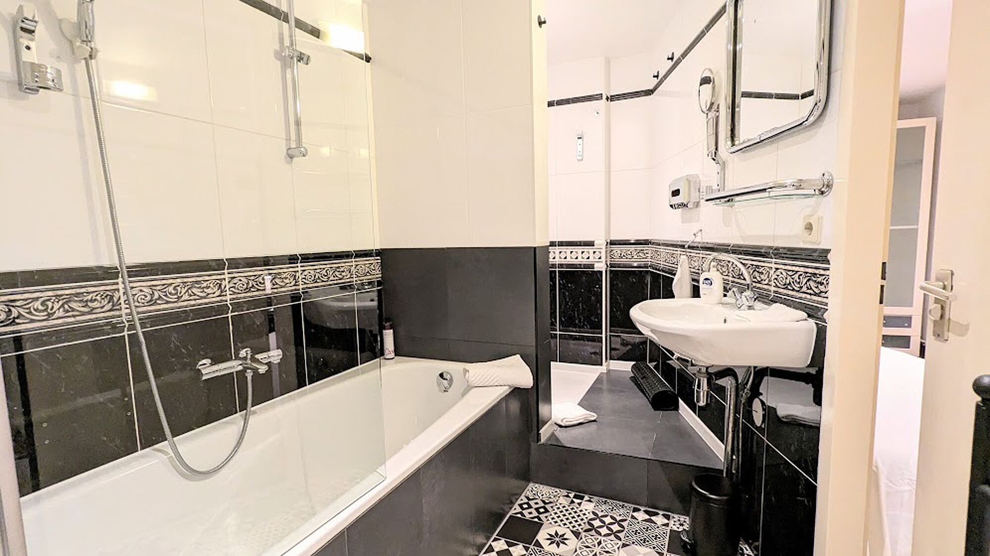 Bathtub, hair dryer, towels, soap