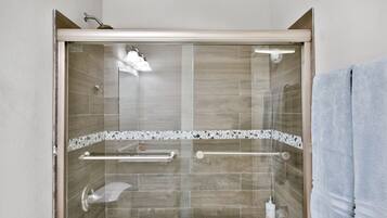 Combined shower/tub, hair dryer, towels, soap