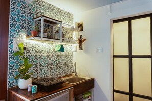 Fridge, electric kettle, cookware/dishes/utensils, spices
