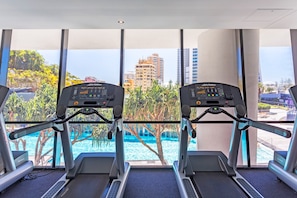 Work out with a view of the pool and lush surroundings.