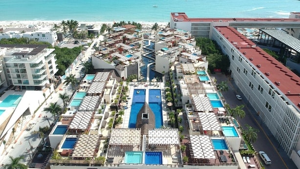 A resort with multiple swimming pools, a beach, and a view of the ocean. - Aldea Thai jr suite. Or Studio By OceanFront  for upto 4 pax  (Playa del Carmen)