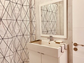 Bathtub, hair dryer, shampoo