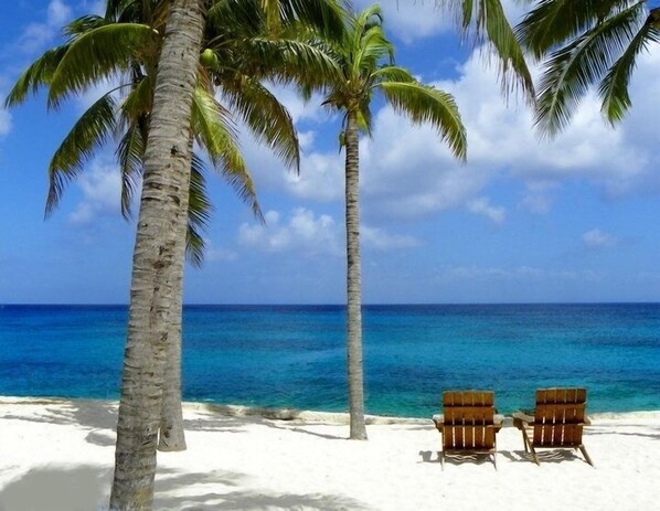 On the beach, sun loungers, beach towels