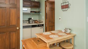 Fridge, microwave, stovetop, coffee/tea maker