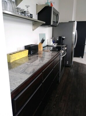 Microwave, dishwasher, coffee/tea maker, cookware/dishes/utensils