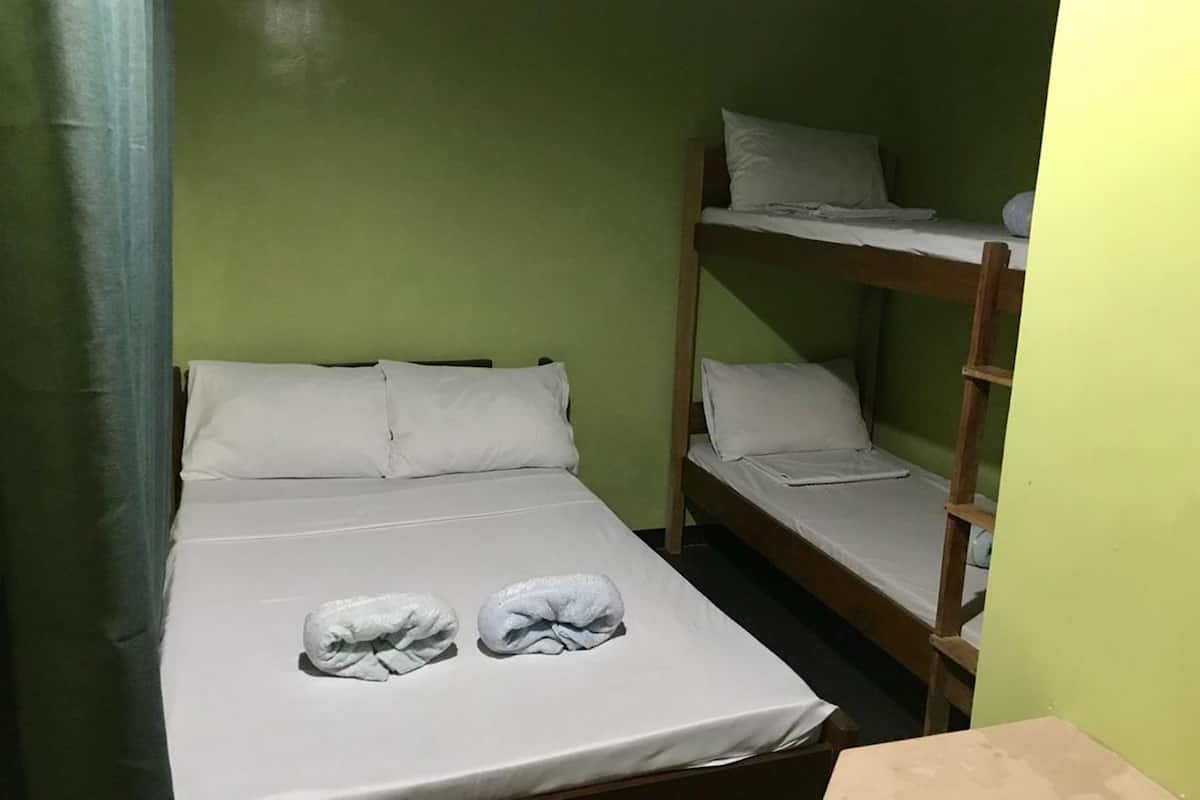 Quadruple Room (Aircon) | Desk, bed sheets