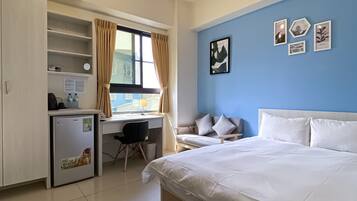 Habitación doble Deluxe | Escritorio, insonorización, wifi gratis y ropa de cama