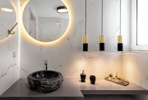 Bathtub, hair dryer, towels, soap