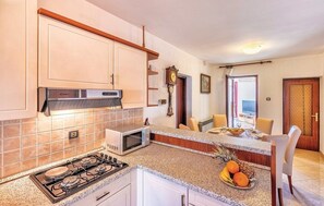 Fridge, oven, coffee/tea maker, cookware/dishes/utensils