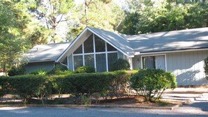 A single-story house with a gabled roof and a covered porch.