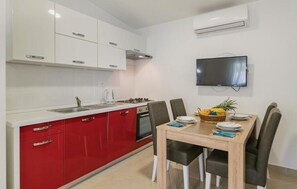 Fridge, dishwasher, coffee/tea maker, cookware/dishes/utensils