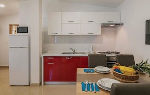 Fridge, dishwasher, coffee/tea maker, cookware/dishes/utensils