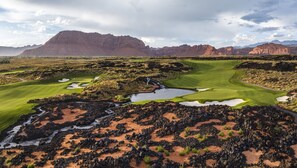Play amidst rugged mountains and challenging fairways with well-maintained green spaces, strategically placed bunkers, and water hazards.