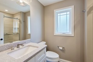 Shower, hair dryer, towels, toilet paper