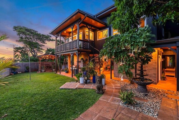 Enjoy a peaceful retreat with a spacious backyard, balcony, and covered porch.