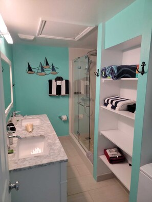 Shower, hair dryer, towels, soap