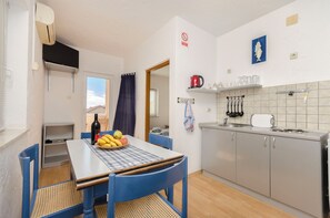 Apartment (A2) | Private kitchen | Fridge, microwave, stovetop, coffee/tea maker