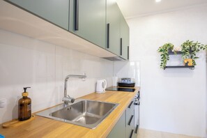 Apartment (A1) | Private kitchen | Fridge, microwave, oven, stovetop