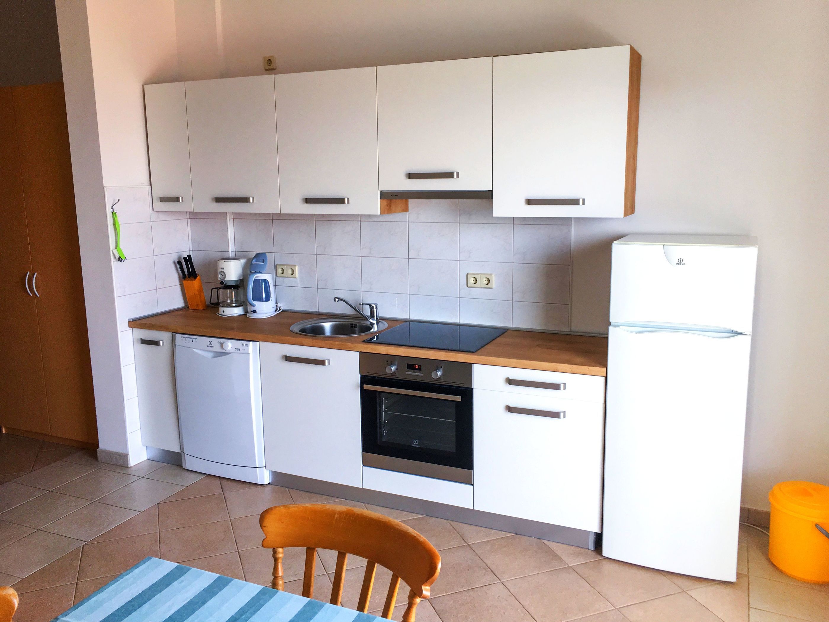 Espresso maker, fridge, stovetop, electric kettle