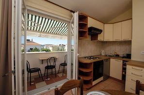 Apartment (A2) | Private kitchen | Fridge, oven, stovetop, dishwasher - Apartments Fila (Vodice)