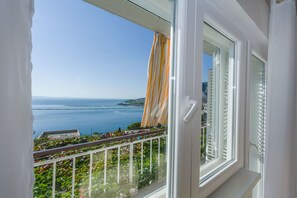 Enjoy breathtaking views of the coastline from this balcony.