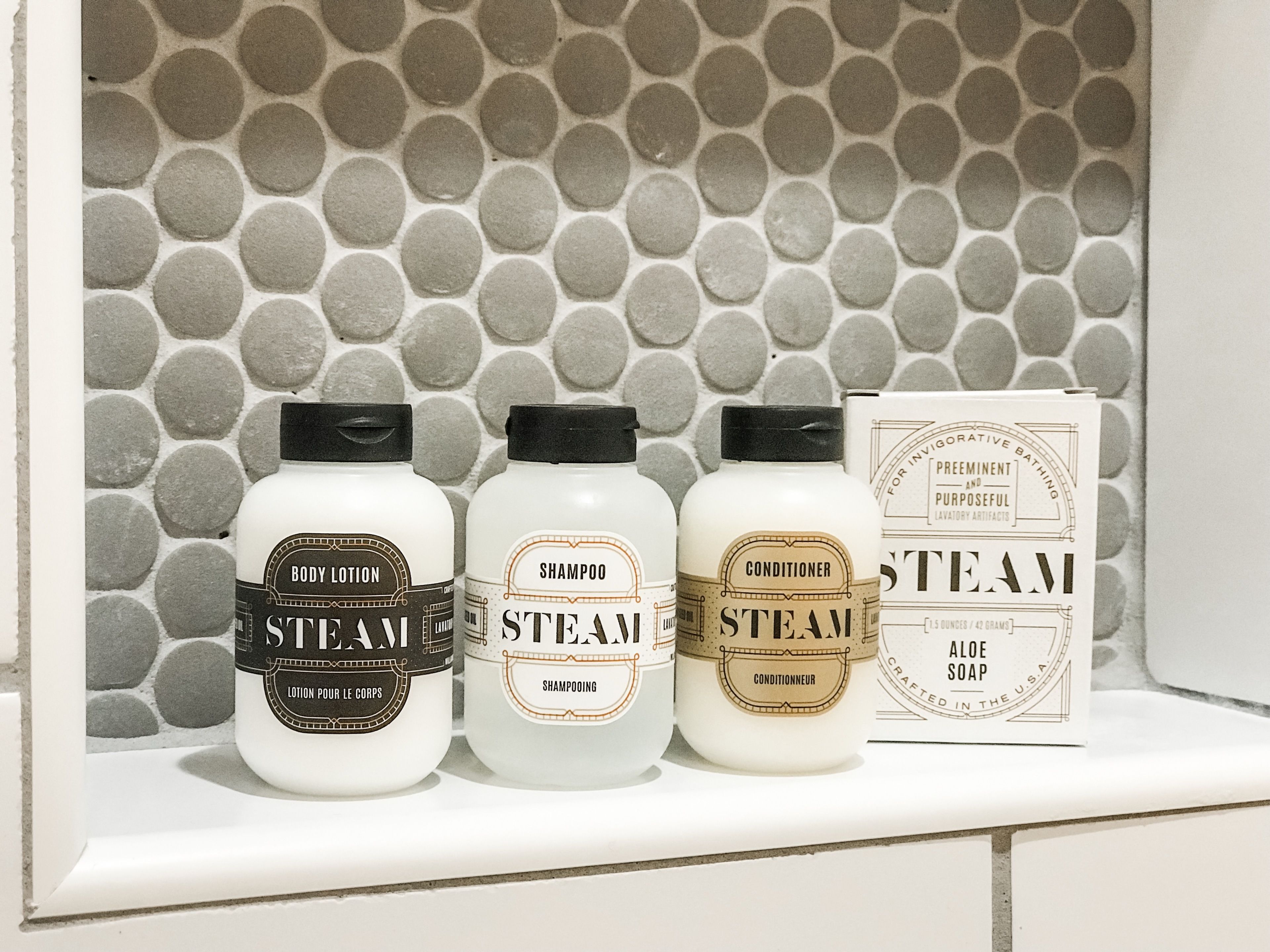 shower, designer toiletries, hair dryer, towels