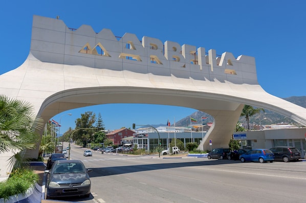 A large archway with the word "MARATHON" prominently displayed.