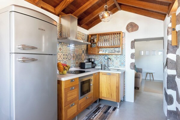 Microwave, stovetop, coffee/tea maker, cookware/dishes/utensils