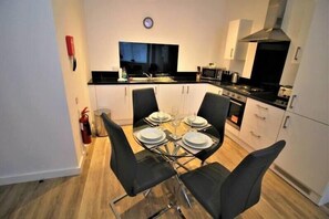 Enjoy meals and snacks at the central island, which doubles as a dining space.