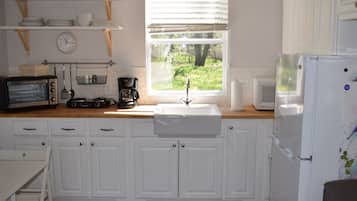 Microwave, coffee/tea maker, cookware/dishes/utensils