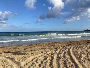 On the beach, sun-loungers, beach towels