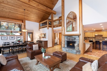 Spacious living area with vaulted ceilings and gas fireplace