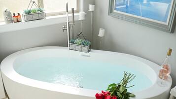 Bathtub, hair dryer, towels, soap