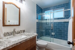 Combined shower/tub, hair dryer, towels, soap
