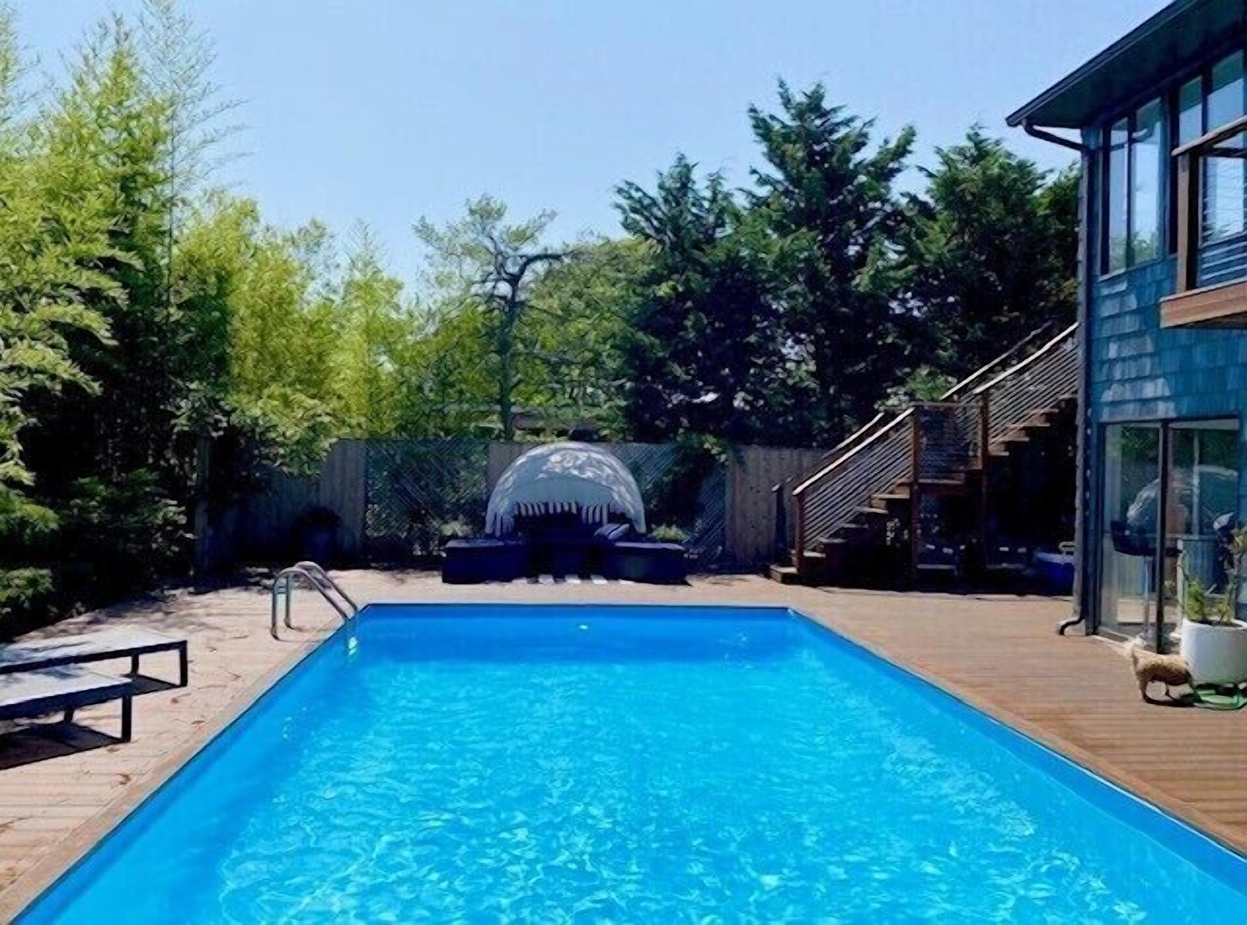 Spotless sun-drenched pool home moments from town and beach.