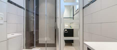 Shower, hair dryer, towels