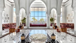 A spacious lobby with high ceilings, large windows, and a central seating area. - Steigenberger Resort Alaya - Adults Friendly 16 Years Plus (El Quseir)