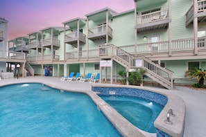 A heated pool, sun loungers