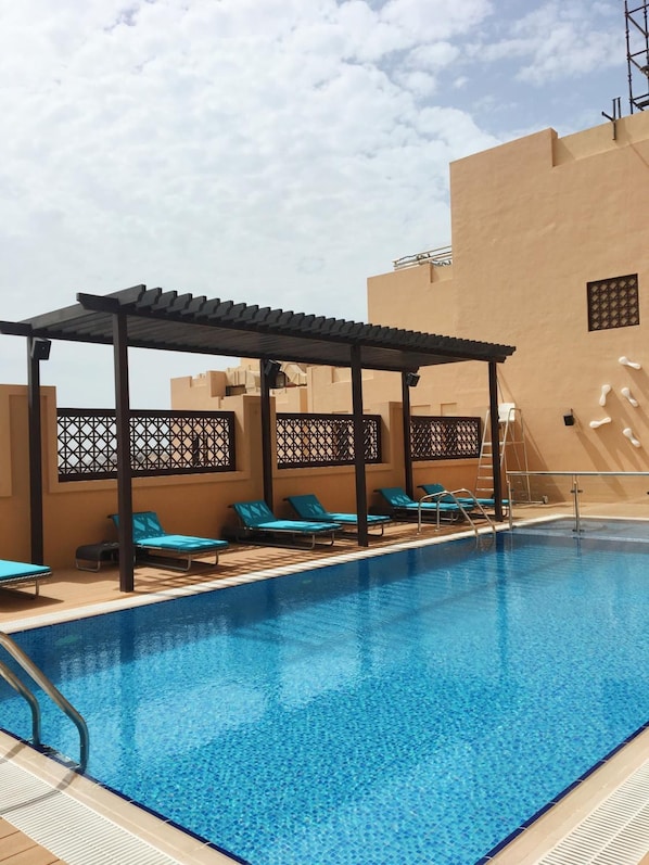 Outdoor pool, pool umbrellas, pool loungers