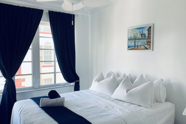 the second bedroom with a smart tv on the wall