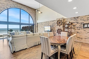 Interior - Floor to Ceiling Arched Window Panoramic View of the Coast in This Split Level Penthouse (Port Aransas)