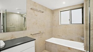 Bathtub, hair dryer, toilet paper