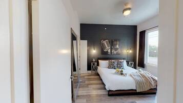 1 bedroom, desk, iron/ironing board, travel crib