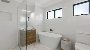 Bathtub, hair dryer, towels