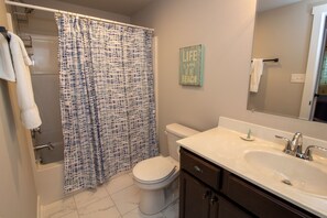 Combined shower/tub, hair dryer, towels, soap