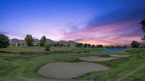 A golf course with bunkers, a pond, and distant mountains. - 122LQ LOOKING NORTH/WEST ON THE NICKLAUS PRIVATE WHAT AN AWSOME MOUNTAIN VIEW AND QUIET (La Quinta)