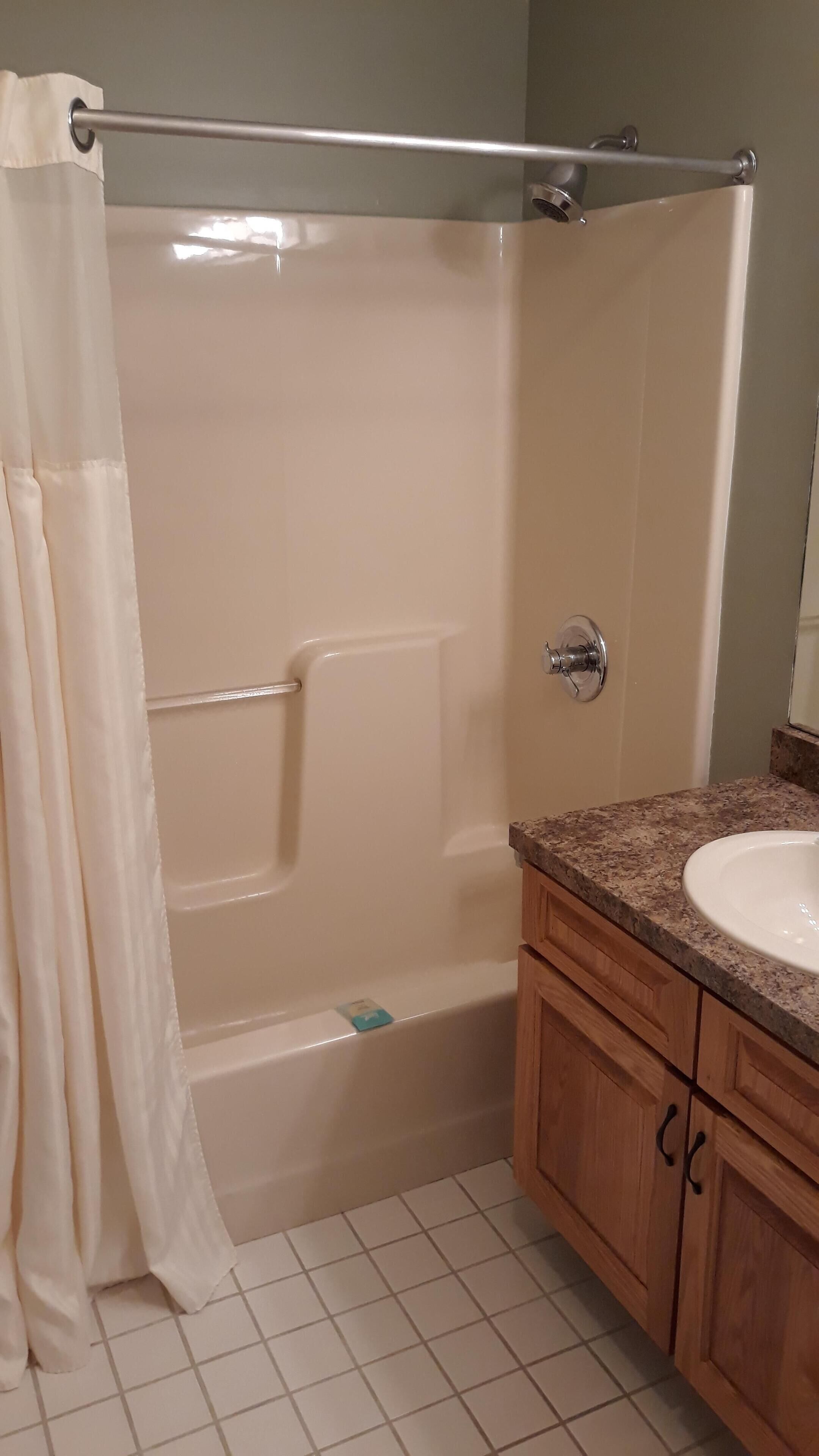 Bathtub, jetted bath, hair dryer, towels