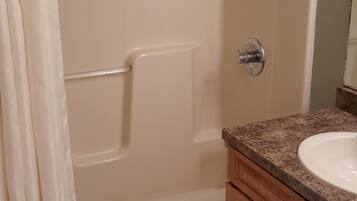 Bathtub, jetted bath, hair dryer, towels