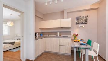 1 bedroom, desk, iron/ironing board, travel cot