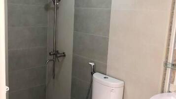 Shower, slippers, soap, shampoo